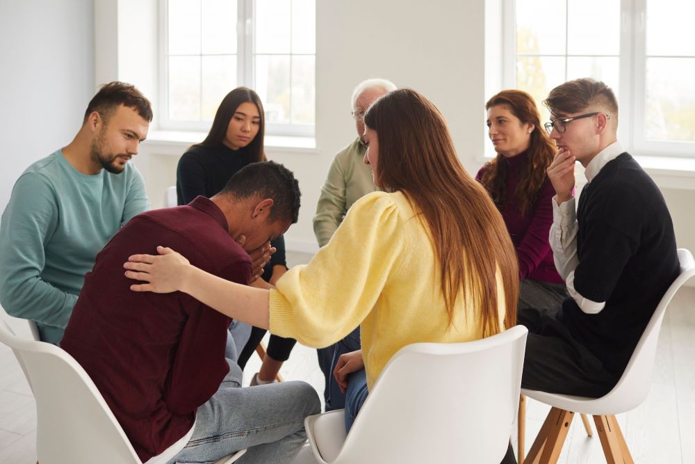 patient sitting in group at new mind wellness learning how to cope with high functioning anxiety