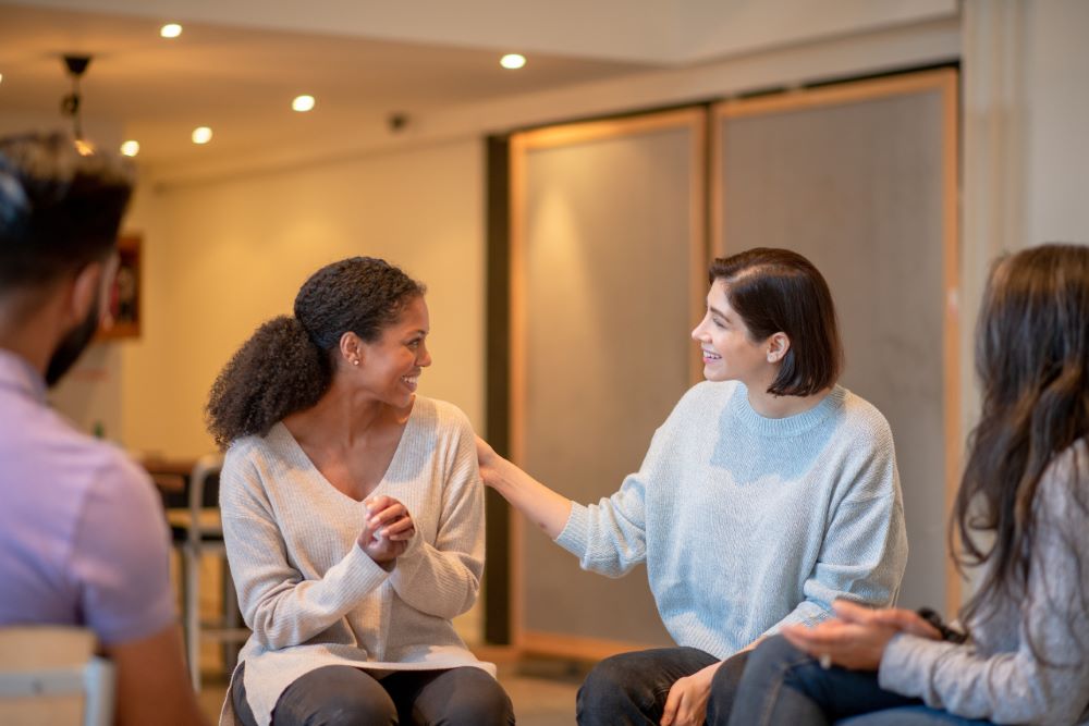 patients sitting in group therapy at new mind wellness discussing what is outpatient mental health treatment