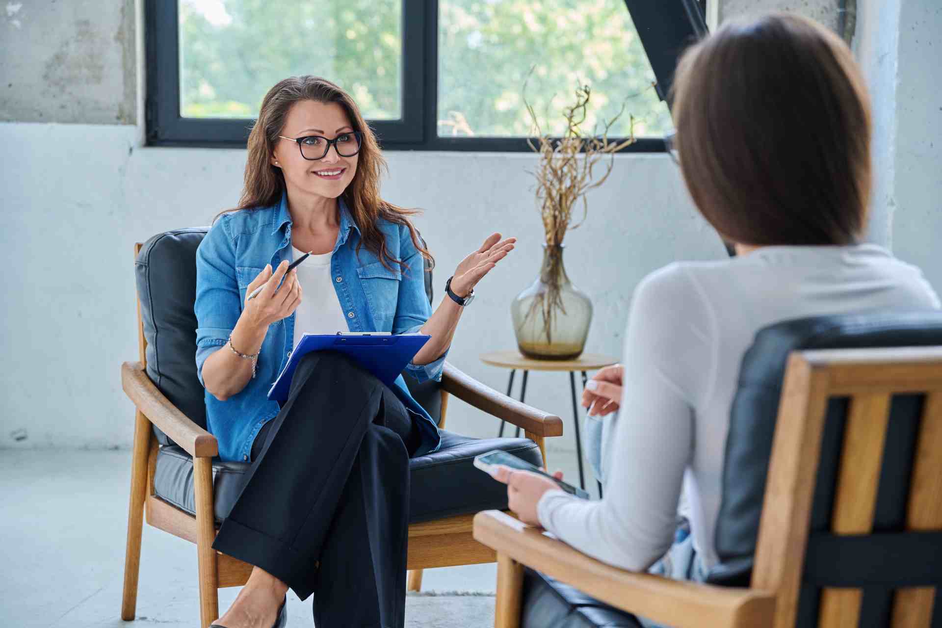 Woman receiving emotional support during a mental health group session