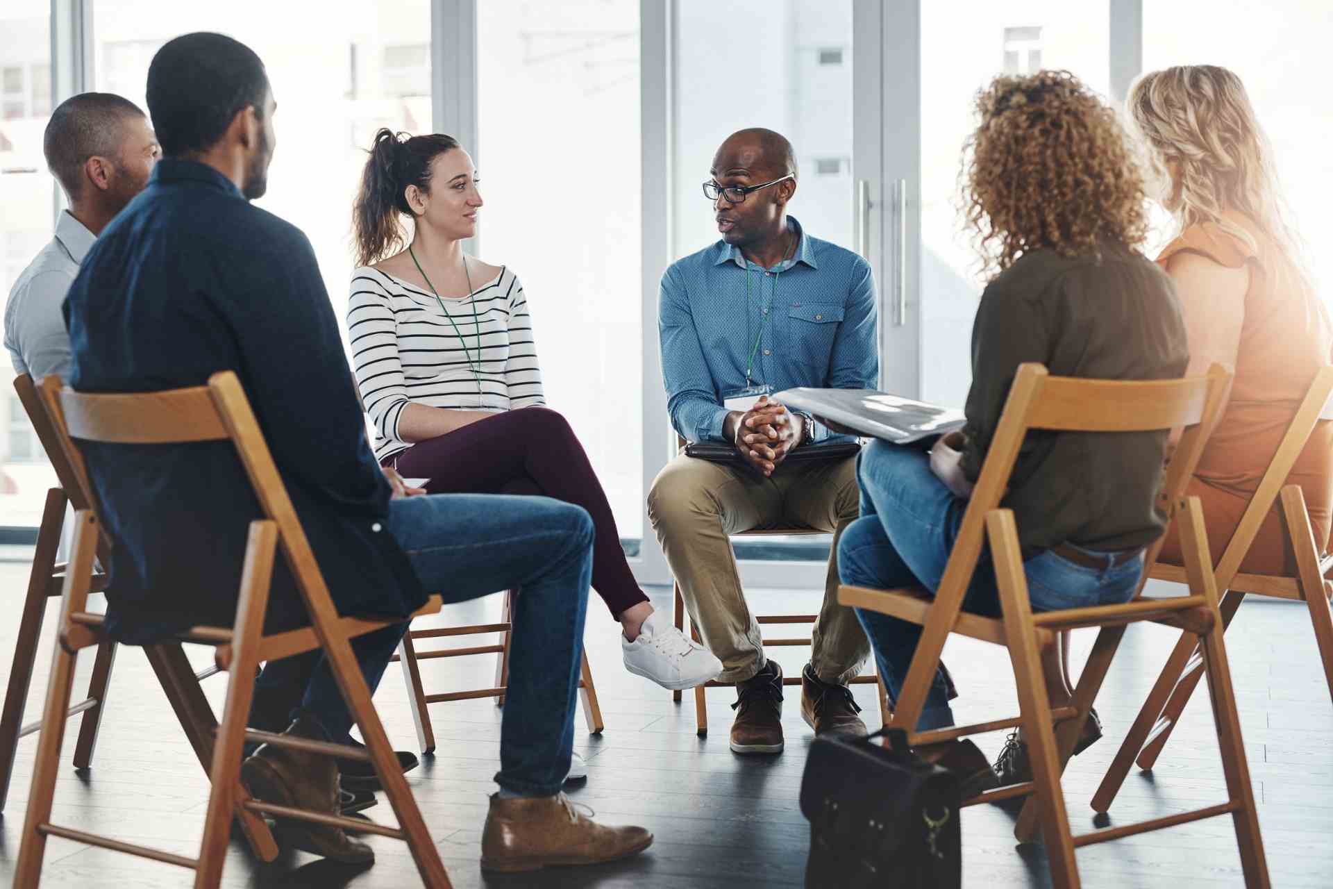 Group therapy session for mental health treatment showing PHP and IOP care levels