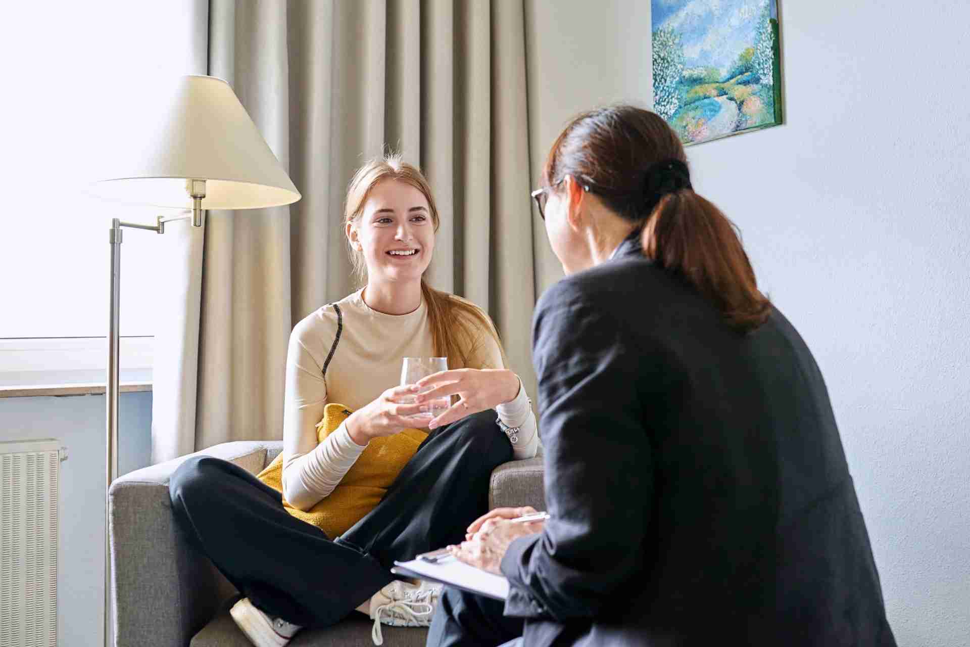 Young woman speaking with a mental health counselor during an individual therapy session