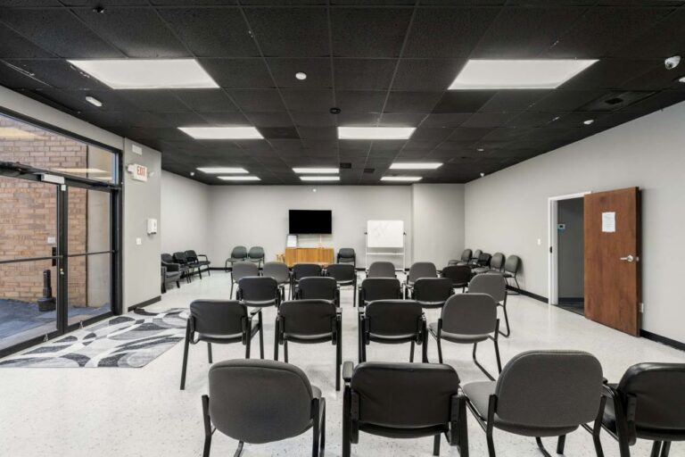 A room set up for a presentation at New Mind Wellness