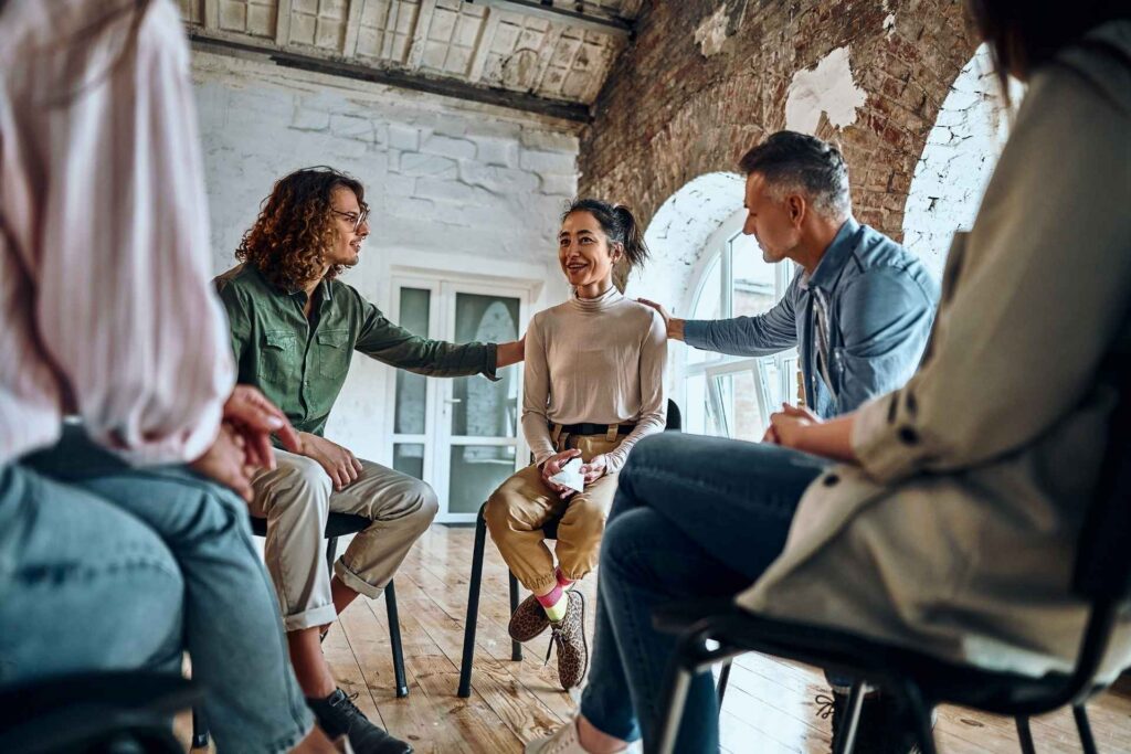 Adults participating in a supportive group therapy session using CBT and DBT skills.