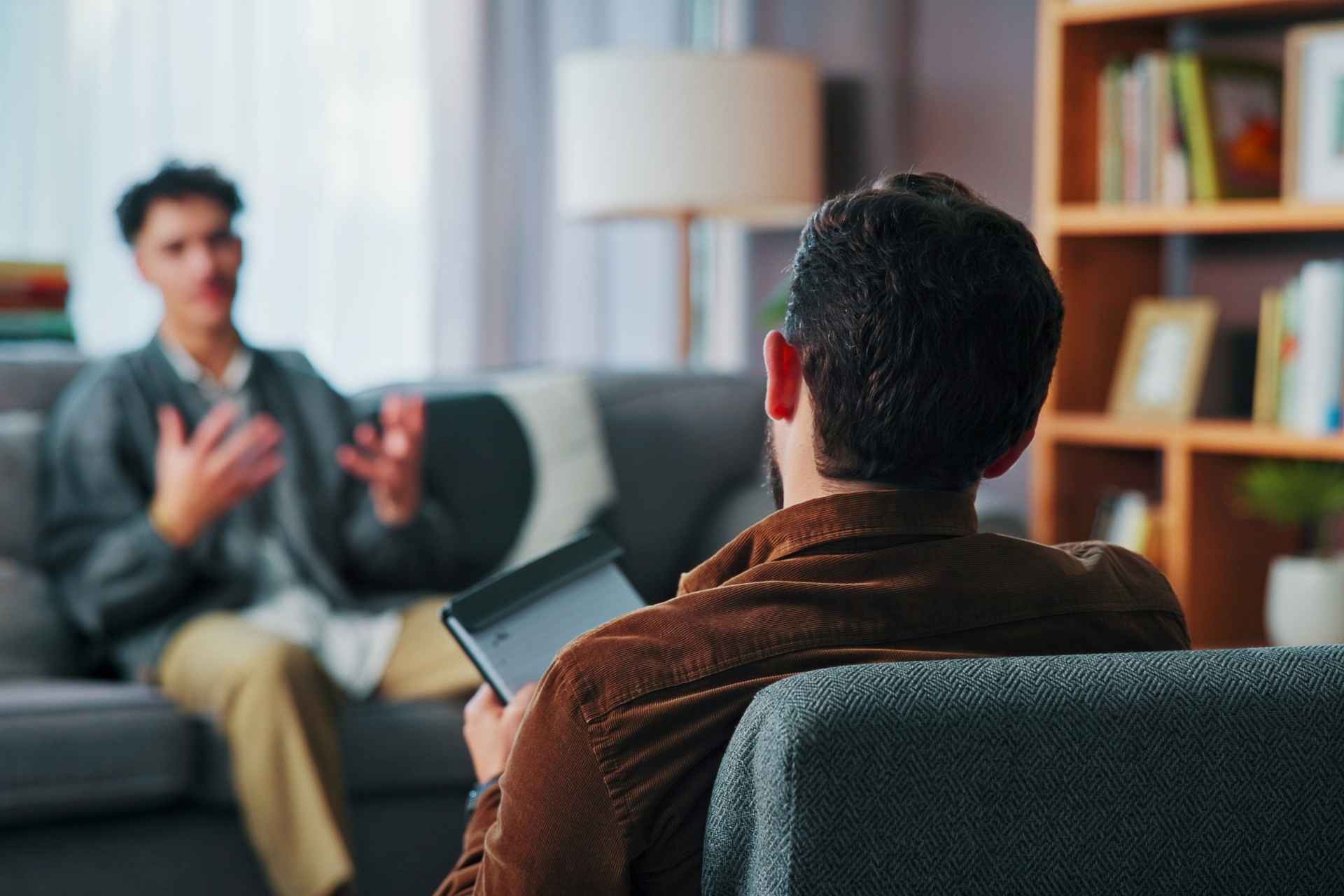 Therapist guiding a client through emotional regulation therapy and coping skills.